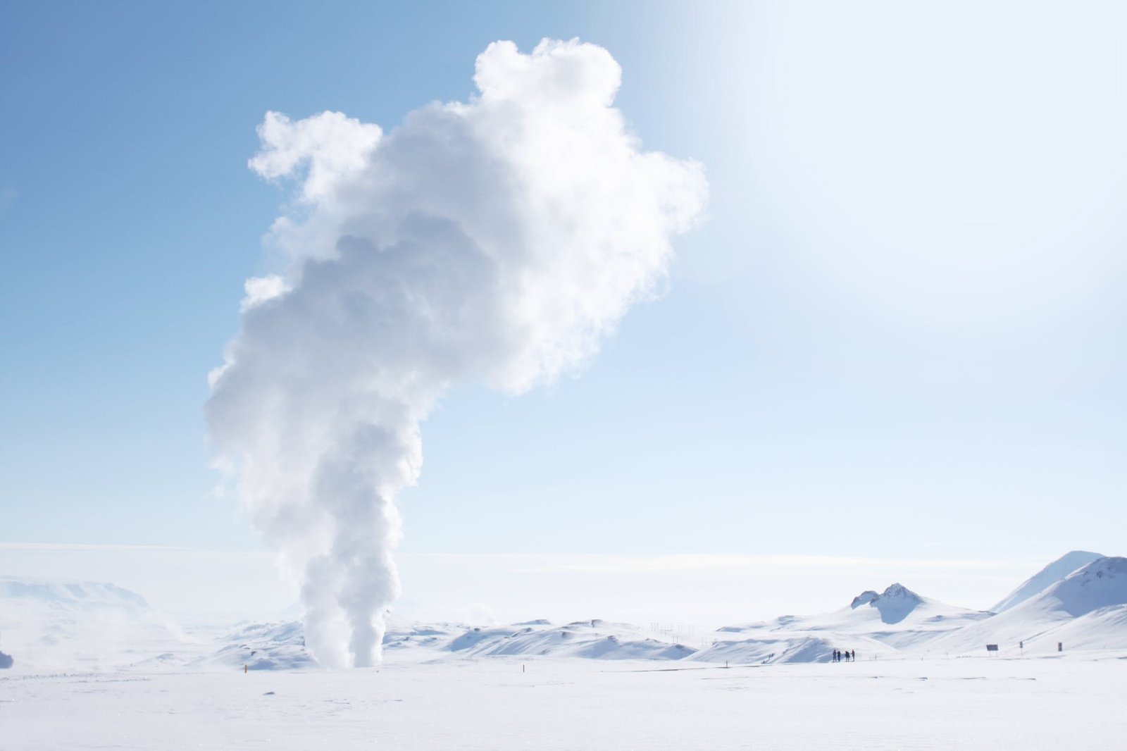 smoke rising from snow covered field