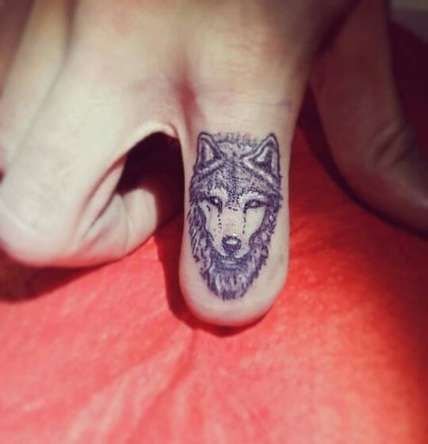 hand tattoo wolf