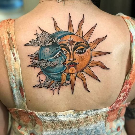 Stylized-blue-moon-and-yellow-sun-tattoo-on-the-upper-back