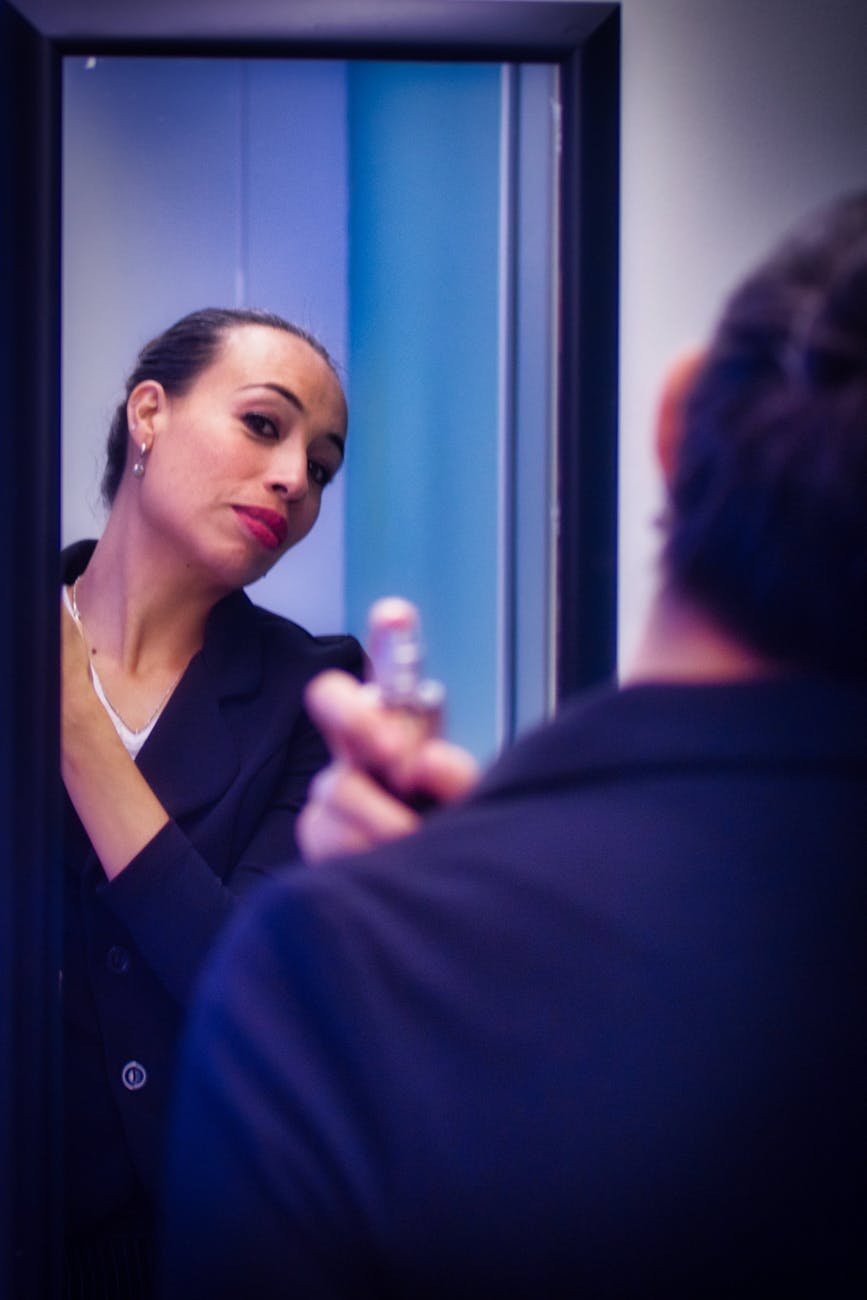 woman in front of mirror